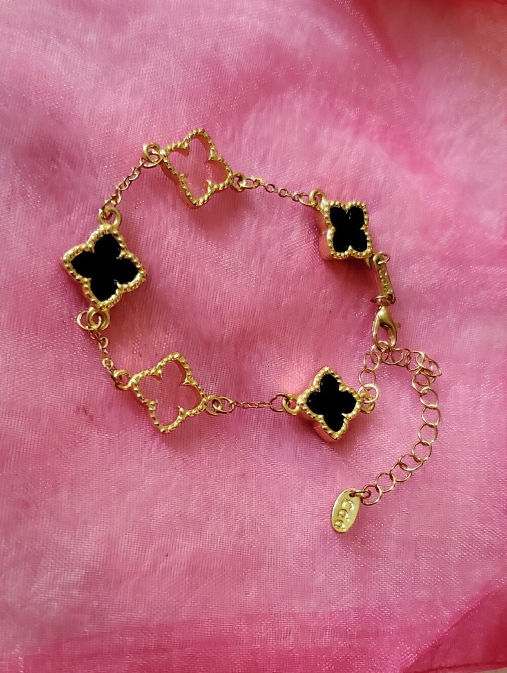 Black And Gold Clover Station Bracelet Alternating Cutouts.